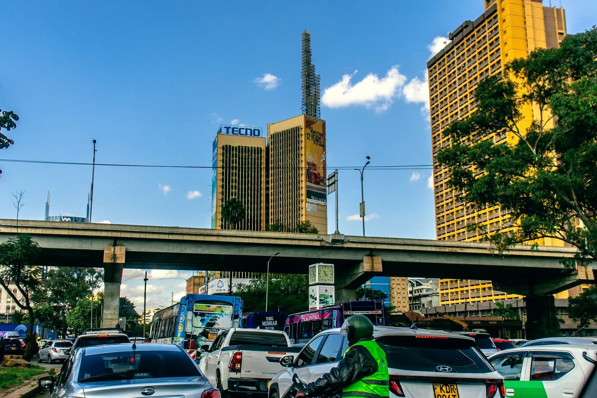 Traffic and office towers on a clear day in central Nairobi.